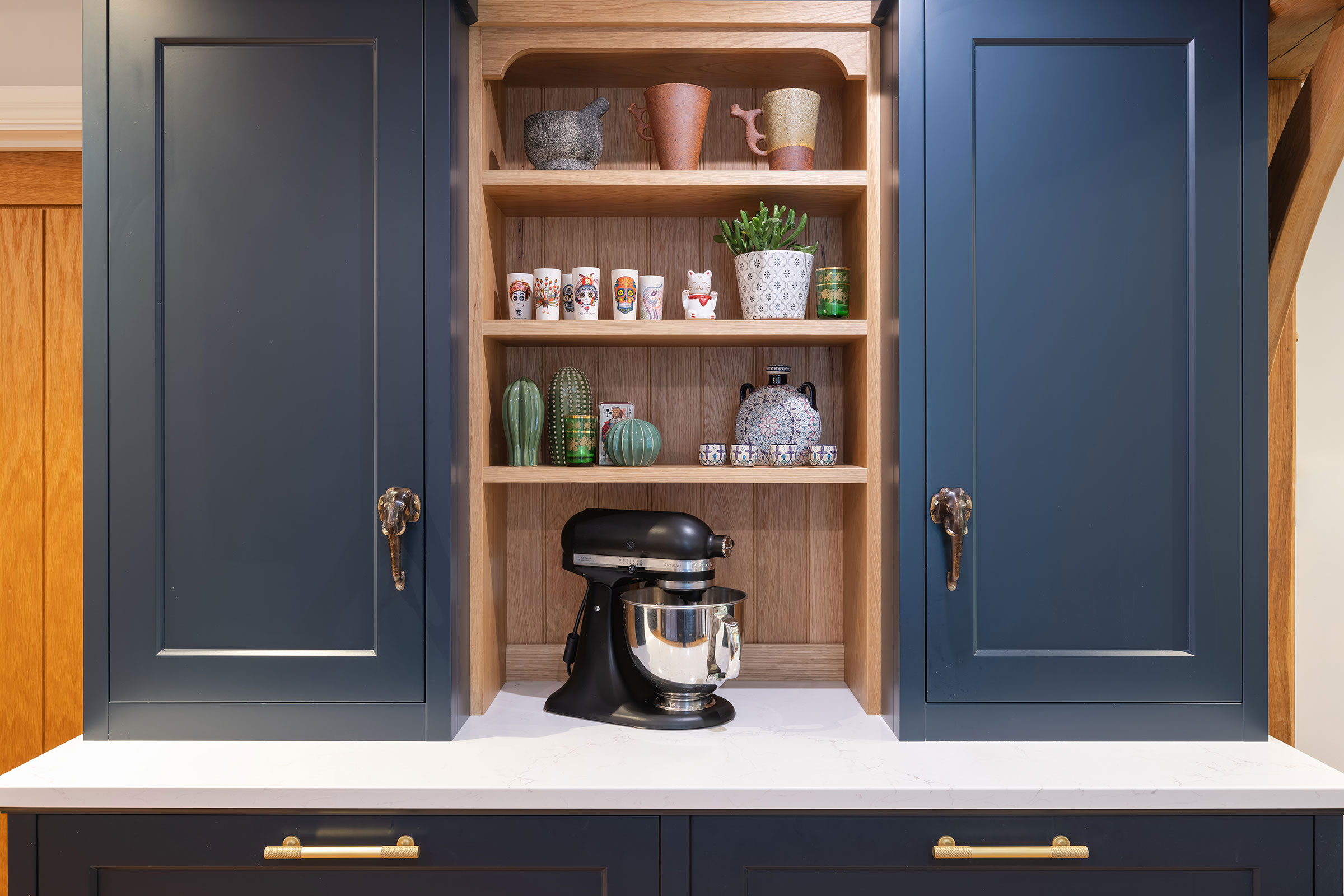 split pantry with open shelving display and antique handles