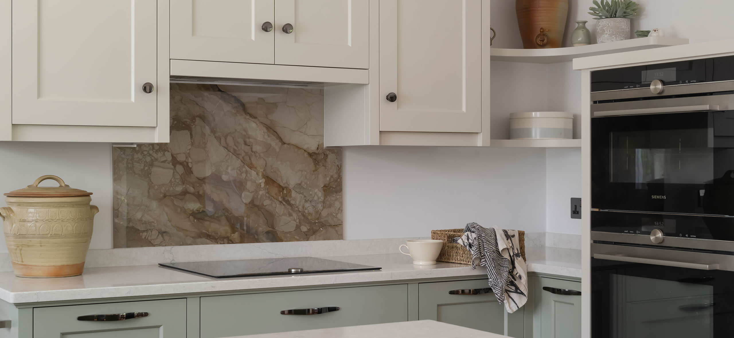 a simple and welcoming kitchen with bespoke curved shelves