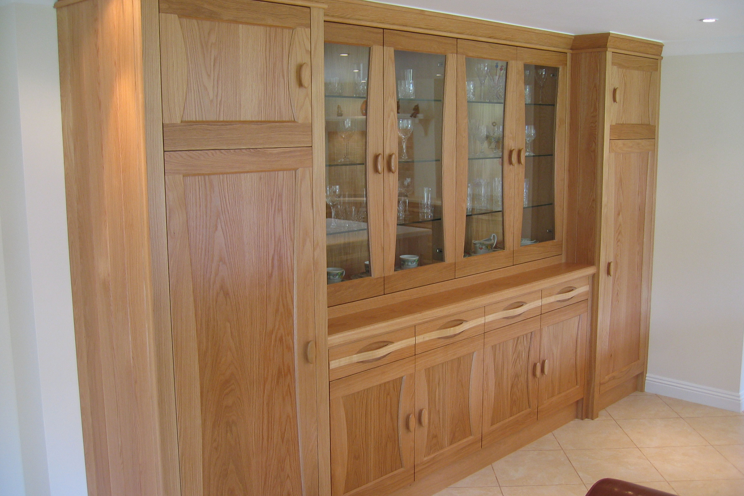 Bespoke cabinetry with grain matched wood across units
