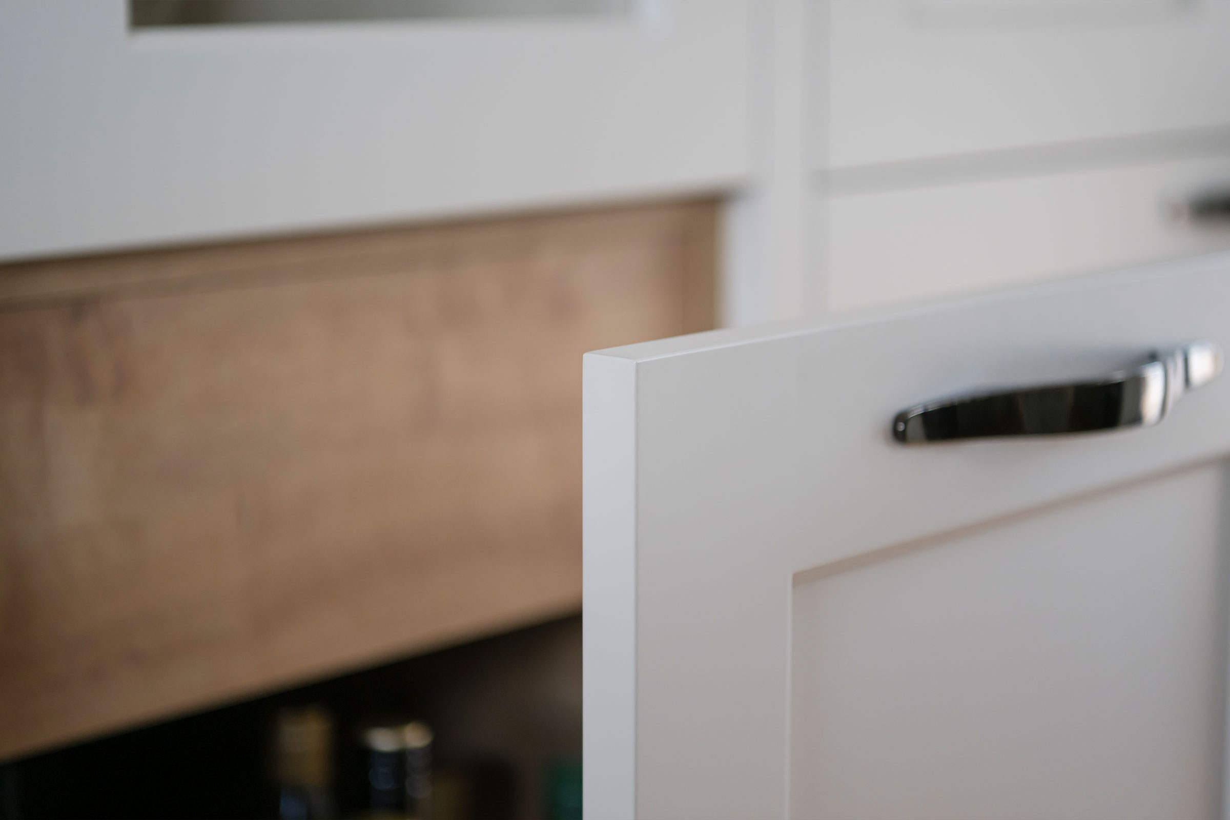 Hidden oak drawers within soft close pull-out cabinetry