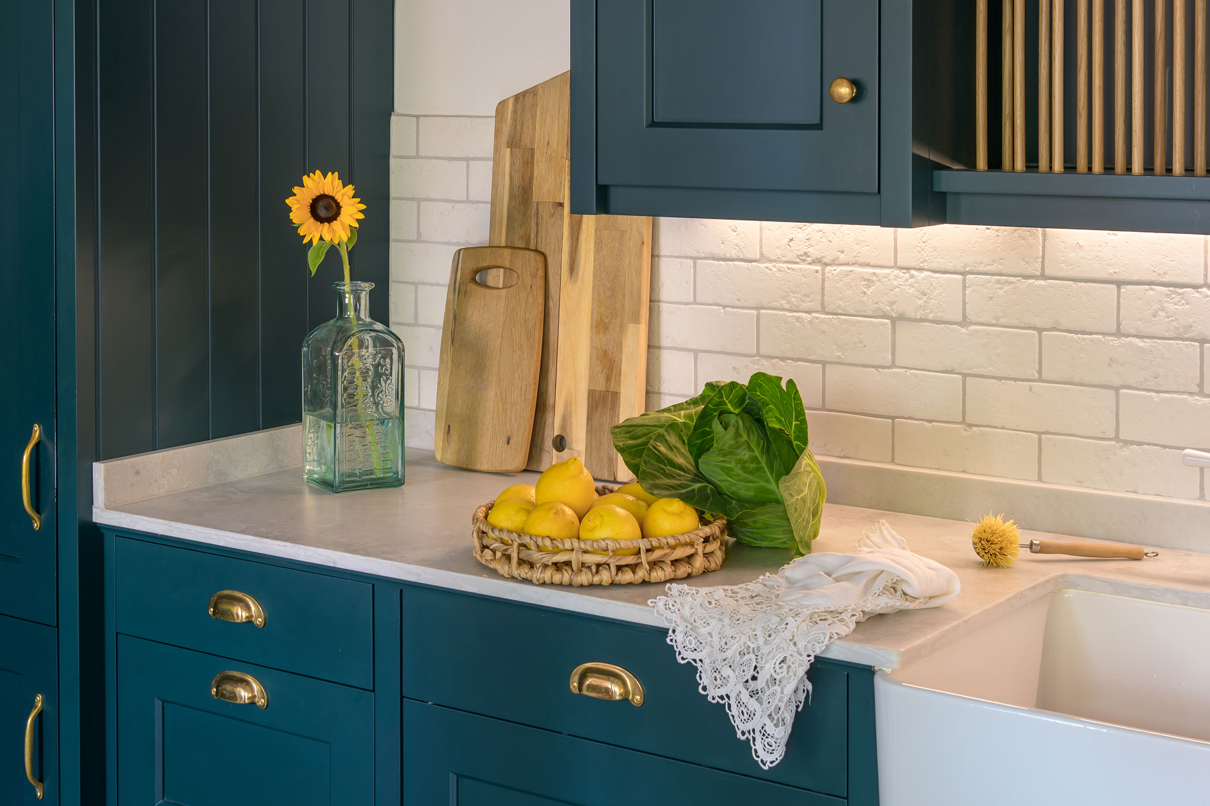 traditional plate rack, tongue and groove cabinetry with brass handles