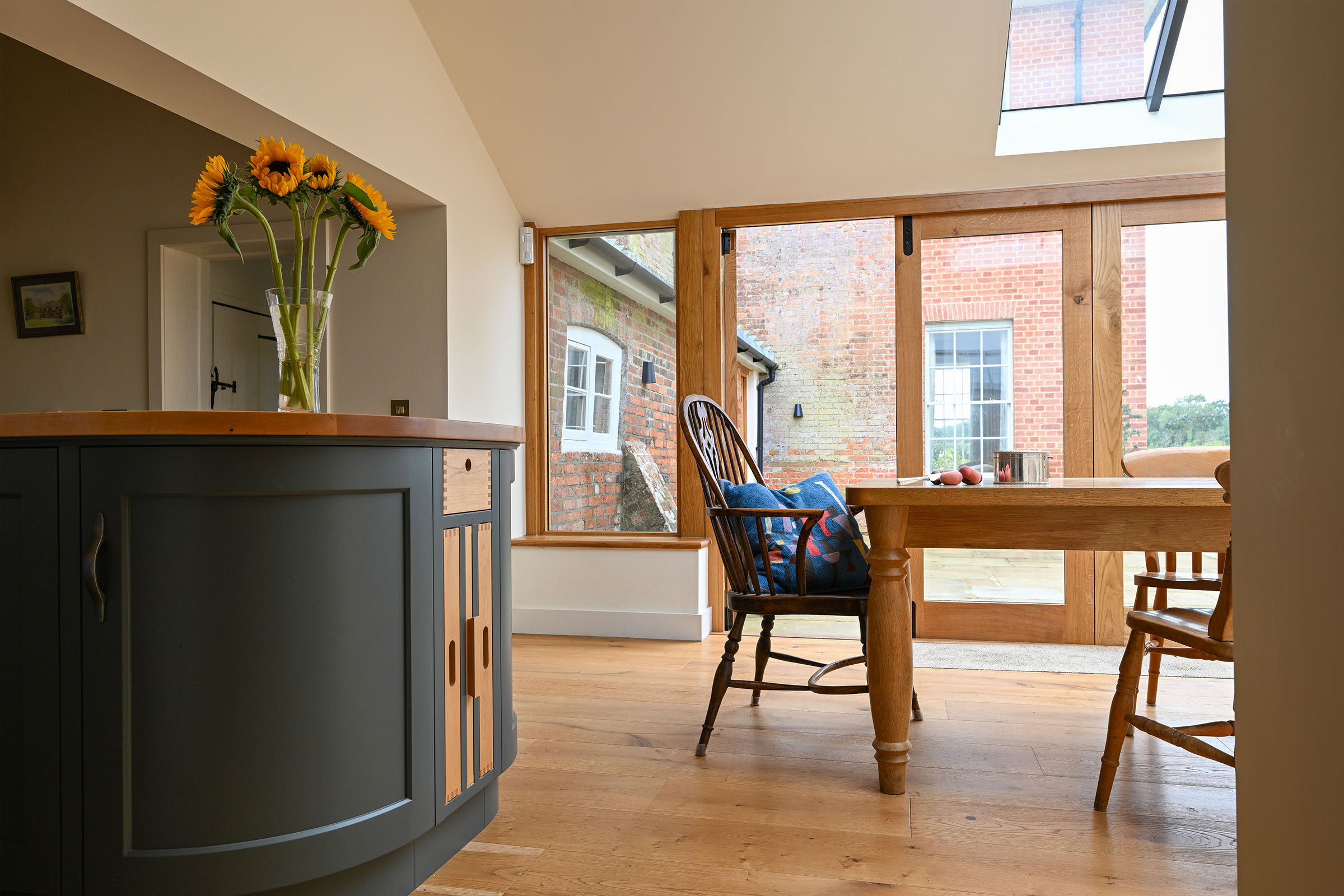 bespoke curved cabinetry and oak tray inserts with dovetail detail